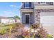 Inviting front porch with decorative stone and landscaping at 356 Runner Stone Ln, Fort Mill, SC 29715