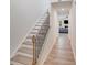 Bright entryway hallway with wood floors and staircase at 356 Runner Stone Ln, Fort Mill, SC 29715