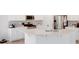 Modern kitchen with white countertops, stainless steel appliances, and a gray tile backsplash at 356 Runner Stone Ln, Fort Mill, SC 29715