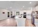 Bright kitchen with white cabinets, stainless steel appliances, and view of the dining area at 356 Runner Stone Ln, Fort Mill, SC 29715