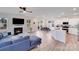Open living space with a fireplace, modern furniture, and wood floors at 356 Runner Stone Ln, Fort Mill, SC 29715