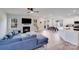 Open living space with a fireplace, modern furniture, and wood floors at 356 Runner Stone Ln, Fort Mill, SC 29715