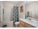 Bright bathroom with a bathtub and shower, a vanity with a sink, and coordinated decor at 3604 Braefield Dr, Indian Trail, NC 28079