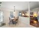 Charming dining area adjacent to the living room, with a round table and stylish lighting fixture, perfect for Gathering meals at 3604 Braefield Dr, Indian Trail, NC 28079