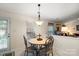 Eat-in kitchen area with round dining table and chairs set near a window at 3604 Braefield Dr, Indian Trail, NC 28079