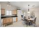 Kitchen with light colored cabinets, dark countertops, and a tiled floor at 3604 Braefield Dr, Indian Trail, NC 28079