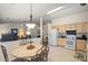 Eat-in kitchen featuring a white refrigerator and light colored cabinets at 3604 Braefield Dr, Indian Trail, NC 28079
