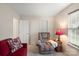 Living room featuring a plush armchair, sofa and lamp at 3604 Braefield Dr, Indian Trail, NC 28079