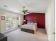 Main bedroom with a bay window, decorative wall and carpet at 3604 Braefield Dr, Indian Trail, NC 28079