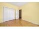 Bedroom features hardwood floors, closet space, ceiling fan and natural light from the window at 3951 Jasmine Ln, Denver, NC 28037