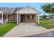 Exterior of a charming brick home with a covered carport and well-maintained landscaping at 3951 Jasmine Ln, Denver, NC 28037