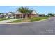 Attractive brick home featuring a covered carport and well-manicured lawn at 3951 Jasmine Ln, Denver, NC 28037