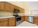 Kitchen features wooden cabinets and stainless steel appliances at 3951 Jasmine Ln, Denver, NC 28037