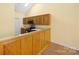 Kitchen with wooden cabinets and stainless steel appliances at 3951 Jasmine Ln, Denver, NC 28037