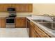 Kitchen featuring wooden cabinets and stainless steel appliances at 3951 Jasmine Ln, Denver, NC 28037