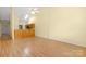 Spacious living room boasting wood floors, neutral paint, and a combined kitchen and living area at 3951 Jasmine Ln, Denver, NC 28037