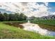 Beautiful pond with fountain and lush greenery, creating a serene and picturesque community setting at 3951 Jasmine Ln, Denver, NC 28037