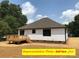 Back of the home featuring a wooden deck, ideal for enjoying the outdoors at 408 N Peterson St, Stanley, NC 28164