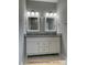 Spacious bathroom vanity features double sinks, granite counters, and updated fixtures at 408 N Peterson St, Stanley, NC 28164