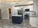 Modern kitchen with stainless steel appliances, granite countertops, and an island with bar seating at 408 N Peterson St, Stanley, NC 28164