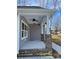 Inviting porch featuring stylish ceiling fan and brick support columns at 408 N Peterson St, Stanley, NC 28164
