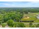 Aerial view of property showcasing the home's location in a green, wooded area at 430 Sells Rd, Salisbury, NC 28144