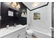 Stylish bathroom with modern vanity, tiled walls, and tub at 430 Sells Rd, Salisbury, NC 28144