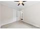 This bedroom has light carpet, a ceiling fan, and a closet at 430 Sells Rd, Salisbury, NC 28144