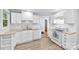 Bright kitchen showcasing white cabinets, subway tile backsplash, and modern appliances at 430 Sells Rd, Salisbury, NC 28144