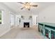 Living room featuring a fireplace and views into the kitchen, creating an inviting space at 430 Sells Rd, Salisbury, NC 28144