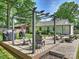 Spacious backyard deck featuring outdoor seating, a grill and a pergola for outdoor gatherings at 4921 Doris Ave, Charlotte, NC 28205