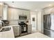 Modern kitchen features white cabinets, stainless steel appliances, and quartz countertops at 4921 Doris Ave, Charlotte, NC 28205