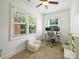 Bright office space featuring natural light, modern desk setup, and comfortable seating area at 4921 Doris Ave, Charlotte, NC 28205