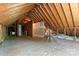 Unfinished attic space showing wood framing and some insulation at 5022 Saybrook Dr, Harrisburg, NC 28075