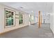 Spacious finished basement with windows and wooden support beams at 5022 Saybrook Dr, Harrisburg, NC 28075