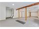 Finished basement space with carpet, wood columns and ceiling tiles at 5022 Saybrook Dr, Harrisburg, NC 28075