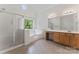 Bright bathroom features a large soaking tub, separate shower, and double sink vanity at 5022 Saybrook Dr, Harrisburg, NC 28075