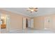 Large main bedroom features a ceiling fan and multiple entrances to the bathroom and other rooms at 5022 Saybrook Dr, Harrisburg, NC 28075