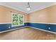 Traditional dining room featuring a large window, wood floors, and two-tone paint scheme at 5022 Saybrook Dr, Harrisburg, NC 28075