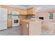 Well-lit kitchen with stainless steel appliances and adjoining dining area at 5022 Saybrook Dr, Harrisburg, NC 28075