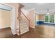Spacious living room featuring hardwood floors and a staircase at 5022 Saybrook Dr, Harrisburg, NC 28075