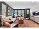 Stylish living room with large windows, comfortable seating, and unique wall decor at 510 Lockwood Creek Dr # 28, Charlotte, NC 28208