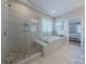 Beautiful bathroom featuring a glass enclosed shower and soaking tub at 5128 Oakhaven Ln, Fort Mill, SC 29708