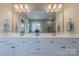 Bathroom with double vanity and a large mirror for a spacious feeling at 5128 Oakhaven Ln, Fort Mill, SC 29708
