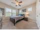 Cozy bedroom enhanced with a ceiling fan and natural light at 5128 Oakhaven Ln, Fort Mill, SC 29708