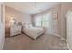 Charming bedroom featuring a comfortable bed and bright windows at 5128 Oakhaven Ln, Fort Mill, SC 29708