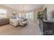 Bright bedroom features a chandelier, accent furniture, and neutral colors at 5128 Oakhaven Ln, Fort Mill, SC 29708