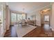 Well-lit dining area with hardwood floors, buffet, and door leading to patio at 5128 Oakhaven Ln, Fort Mill, SC 29708