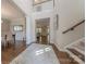 Grand foyer with high ceilings, hardwood floors, elegant staircase, and views into the dining and living spaces at 5128 Oakhaven Ln, Fort Mill, SC 29708