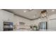Close-up of a modern kitchen featuring white cabinets, stainless steel appliances, and a quartz countertop at 5128 Oakhaven Ln, Fort Mill, SC 29708